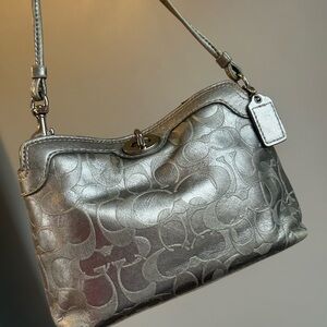 SOLD Coach silver signature leather wristlet / bag